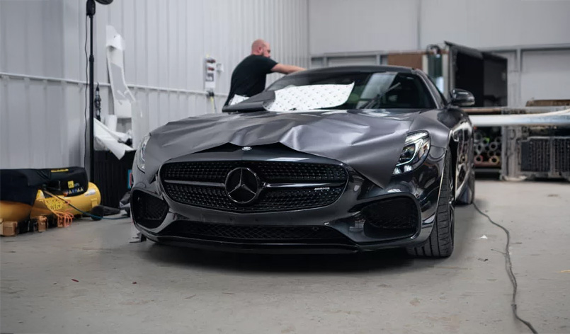 Three colored notebooks arranged on a table, showcasing vibrant hues of blue, red, and green.