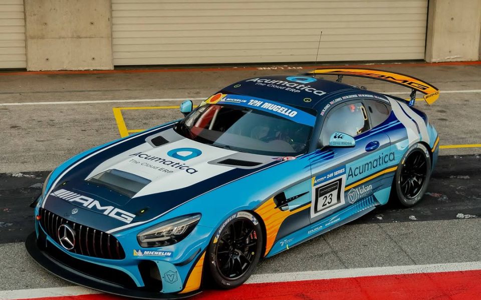 Mercedes AMG GT3 R racing on a track, showcasing its sleek design and performance capabilities. 