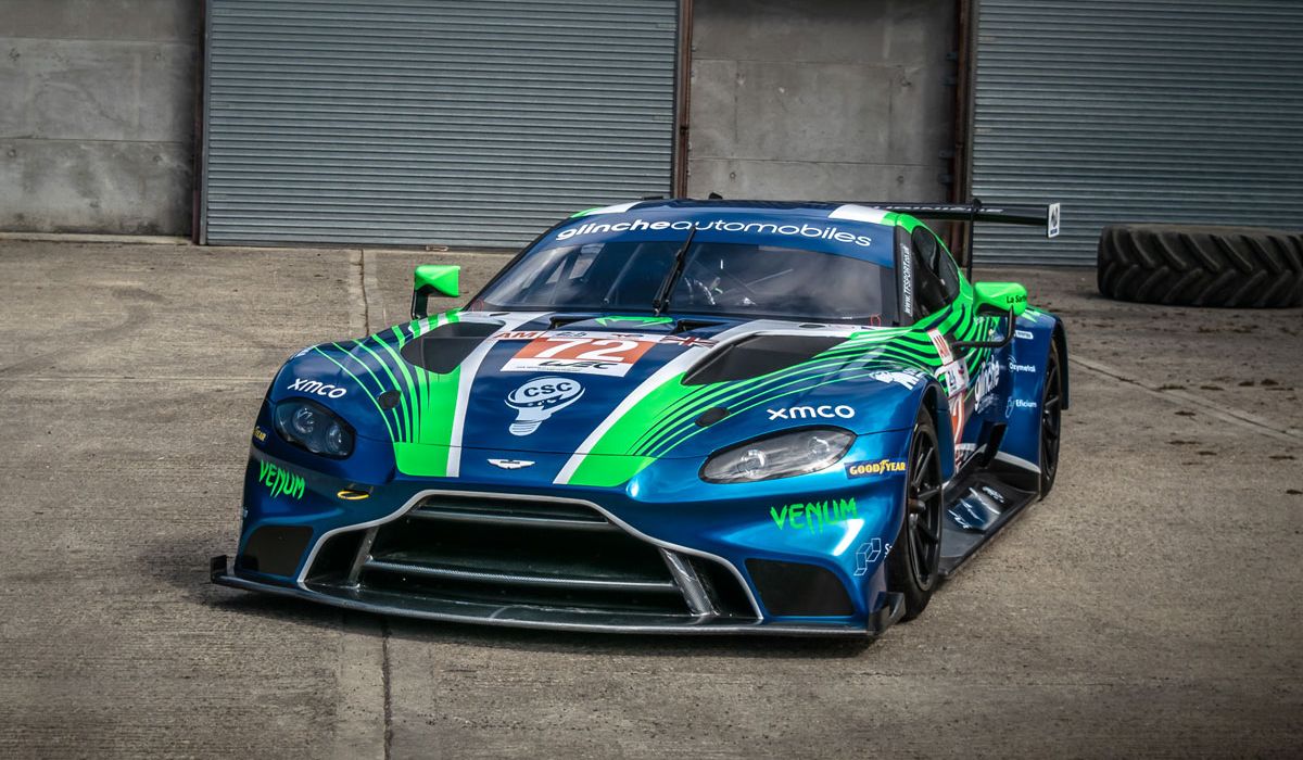 Aston Martin V12 Superleggera GT3 sports car, showcasing its sleek design and racing features on a track.