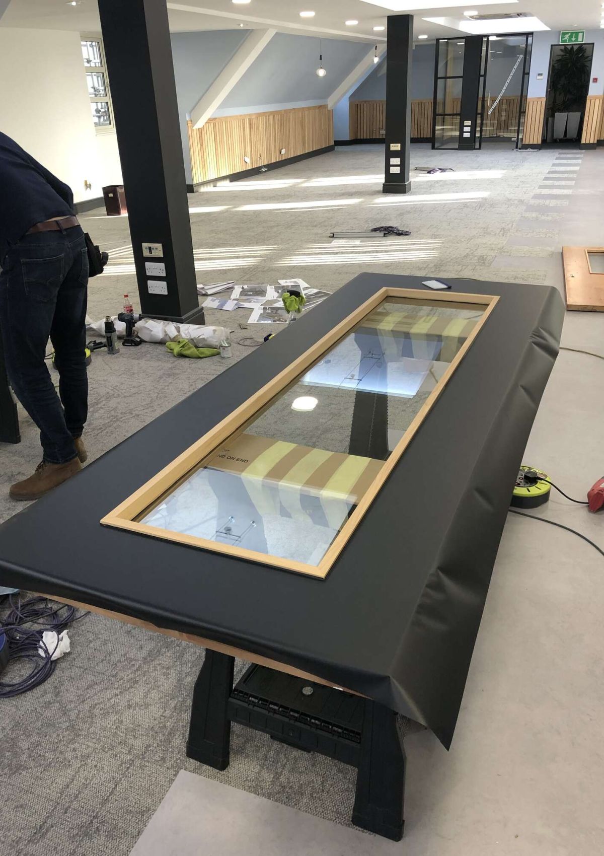 sideway view of a man wrapping a door