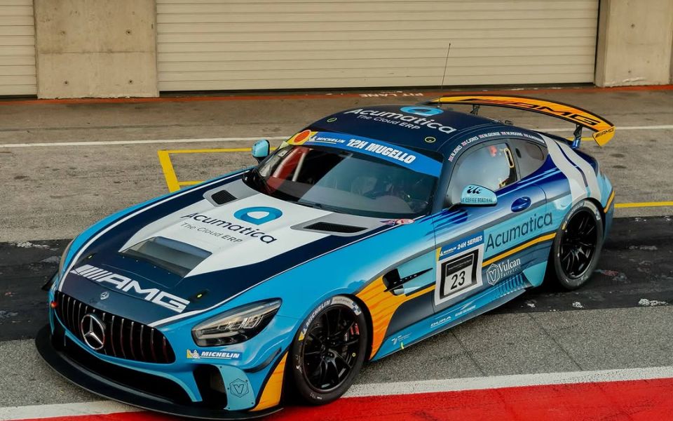 Mercedes AMG GT3 R racing on a track, showcasing its sleek design and performance capabilities. 
