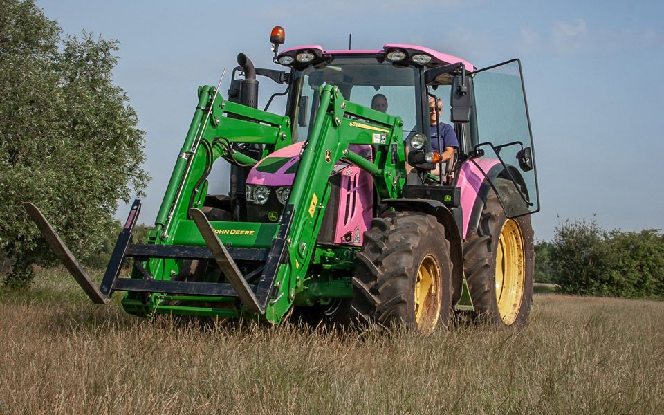 a unique vehicle wrapped in pink